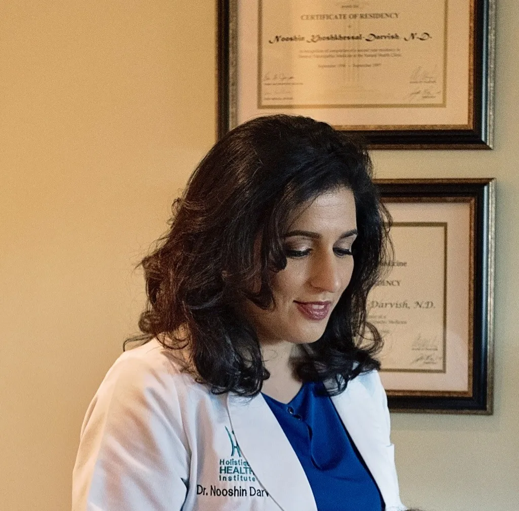 Dr. Darvish at her naturopathic oncology practice discussing cancer as a symptom of deeper causes