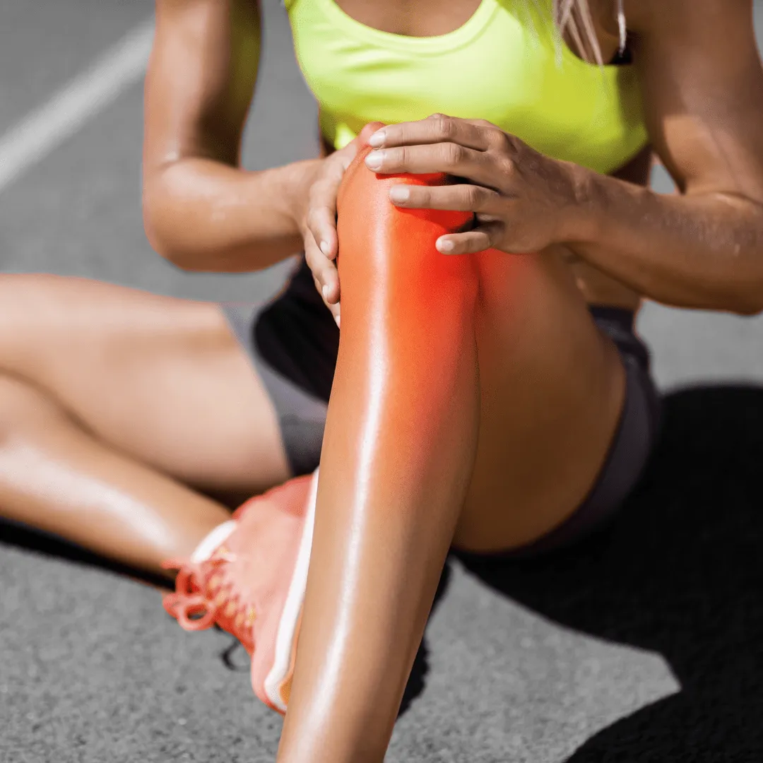 Person holding knee joint representing osteoarthritis and naturopathic joint regeneration treatments