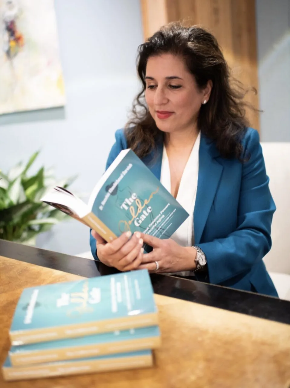 Dr. Darvish reading The Golden Gate book about oxytocin as a longevity and anti-aging hormone